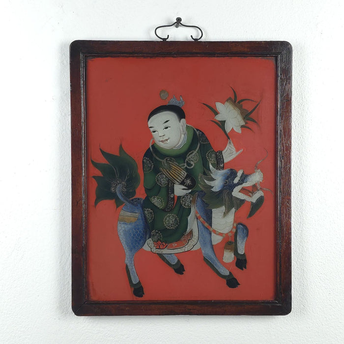 Reverse Glass Painting of a Boy Riding a Qilin, China circa 1920