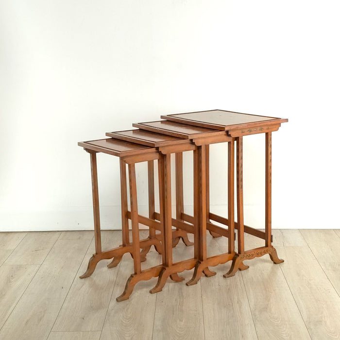 Four Satinwood Fancy Painted Nesting Tables, England, 19th century