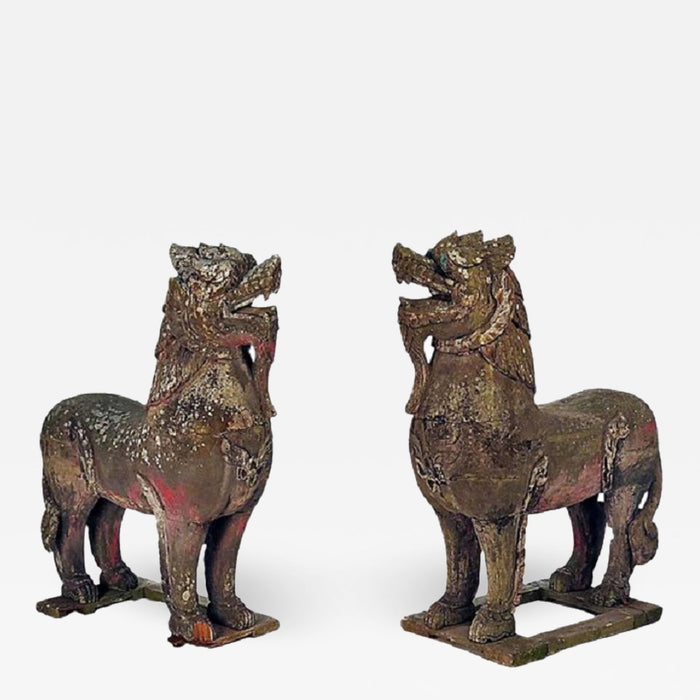 PAIR OF WOOD PALACE LIONS S.E. ASIA WEATHERED WITH MICA EYES